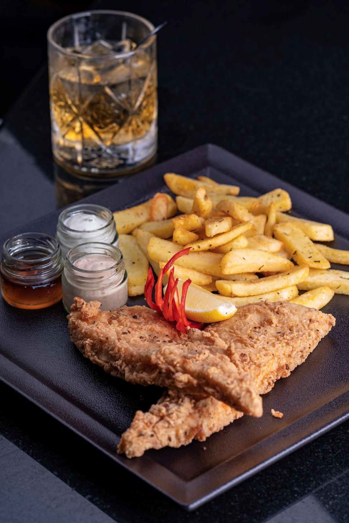 Radisson Blu Hotel & Resort, Sohar Exterior photo Schnitzel with chips